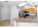 Modern kitchen featuring granite countertops and stainless steel appliances at 3701 Castle Pines Ln # 3927, Orlando, FL 32839