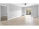 Bright living room with tile floors and sliding glass doors leading to a balcony at 3701 Castle Pines Ln # 3927, Orlando, FL 32839