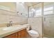 Bathroom with shower, toilet and updated vanity at 4525 Oakbrook Ct, Kissimmee, FL 34746