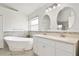 Modern bathroom with double vanity and soaking tub at 4525 Oakbrook Ct, Kissimmee, FL 34746