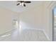 Primary bedroom with ceiling fan and sliding door to patio at 4525 Oakbrook Ct, Kissimmee, FL 34746