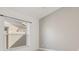 Bedroom with large window and grey accent wall at 4525 Oakbrook Ct, Kissimmee, FL 34746