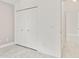 Bedroom with double door closet and wood-look tile floor at 4525 Oakbrook Ct, Kissimmee, FL 34746