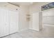 Bright bedroom with double door closet and wood-look tile floor at 4525 Oakbrook Ct, Kissimmee, FL 34746