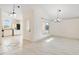 Spacious dining room with chandelier and large windows at 4525 Oakbrook Ct, Kissimmee, FL 34746