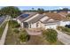 One-story home with solar panels, landscaped yard, and attached garage at 4525 Oakbrook Ct, Kissimmee, FL 34746