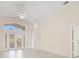 Bright living room with vaulted ceilings and tile floors at 4525 Oakbrook Ct, Kissimmee, FL 34746