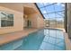 Inviting screened-in pool with tiled deck and lanai access at 4525 Oakbrook Ct, Kissimmee, FL 34746