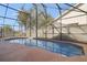 Enjoy this refreshing screened pool area with a large patio at 4525 Oakbrook Ct, Kissimmee, FL 34746