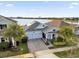 Single-Gathering home with solar panels and a view of a lake at 4540 Sequel Rd, Kissimmee, FL 34746