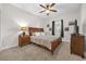 Primary bedroom with king-size bed and water views at 4540 Sequel Rd, Kissimmee, FL 34746