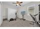 Home gym with elliptical, treadmill, and wall-mounted TV at 4540 Sequel Rd, Kissimmee, FL 34746