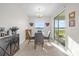 Bright breakfast nook with table and chairs, overlooking lake at 4540 Sequel Rd, Kissimmee, FL 34746