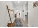 Bright and spacious entryway with a bench and coat rack at 4540 Sequel Rd, Kissimmee, FL 34746