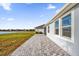House exterior with a patio and lake view at 4540 Sequel Rd, Kissimmee, FL 34746