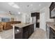 Island kitchen with seating and stainless steel appliances at 4540 Sequel Rd, Kissimmee, FL 34746