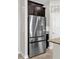 Stainless steel refrigerator with two doors and freezer drawers at 4540 Sequel Rd, Kissimmee, FL 34746