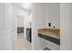 Convenient laundry room with built-in countertop and cabinets at 4540 Sequel Rd, Kissimmee, FL 34746