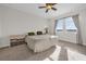 Large bedroom with lake view and ceiling fan at 4540 Sequel Rd, Kissimmee, FL 34746