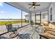 Spacious screened porch with lake view and comfy seating at 4540 Sequel Rd, Kissimmee, FL 34746