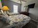 Bright bedroom featuring two twin beds with sea-themed bedding and dark wood flooring at 4557 Ada Ln, Kissimmee, FL 34746