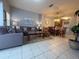 Spacious living room with comfortable seating and easy access to dining and kitchen areas at 4557 Ada Ln, Kissimmee, FL 34746