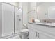 Clean bathroom with shower, toilet, and vanity with granite countertop at 4818 Memories Ln, Kissimmee, FL 34746