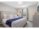 Spacious bedroom with a king-size bed and stylish decor at 4818 Memories Ln, Kissimmee, FL 34746