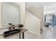 Light and airy entryway with mirror, console table, and view into dining area at 4818 Memories Ln, Kissimmee, FL 34746