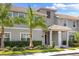 Townhouse exterior during daytime with gray siding and landscaping at 4818 Memories Ln, Kissimmee, FL 34746