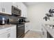 Modern kitchen with white cabinets, stainless steel appliances at 4818 Memories Ln, Kissimmee, FL 34746