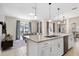 Open kitchen with island, looking toward living room and pool at 4818 Memories Ln, Kissimmee, FL 34746