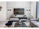 Living room with sectional sofa, large TV, and accent pieces at 4818 Memories Ln, Kissimmee, FL 34746