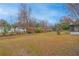 Large backyard with mature trees, providing ample space at 5265 Letha St, Orlando, FL 32811