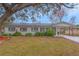 Refurbished single-story home with a tree-lined front yard at 5265 Letha St, Orlando, FL 32811