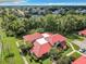 An aerial view showcasing a townhouse with a red tile roof at 540 Hunter Cir, Kissimmee, FL 34758
