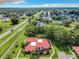 Aerial view of a red-roofed townhouse nestled in a wooded area at 540 Hunter Cir, Kissimmee, FL 34758