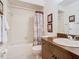 Bathroom with tub, toilet, and wood vanity at 540 Hunter Cir, Kissimmee, FL 34758