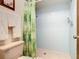 Clean bathroom with shower stall and leafy shower curtain at 540 Hunter Cir, Kissimmee, FL 34758