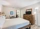 Main bedroom with dresser, TV, and a comfy bed at 540 Hunter Cir, Kissimmee, FL 34758