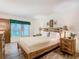 Spacious bedroom with a queen-size bed and wood furniture at 540 Hunter Cir, Kissimmee, FL 34758