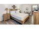 Bright bedroom featuring a wooden bed frame and nightstands at 540 Hunter Cir, Kissimmee, FL 34758