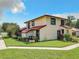 Exterior view of a two-story townhouse with red tile roof at 540 Hunter Cir, Kissimmee, FL 34758