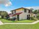 Exterior view of a two-story townhouse with red tile roof at 540 Hunter Cir, Kissimmee, FL 34758