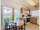 Kitchen with wood cabinets, white countertops, and a round dining table at 540 Hunter Cir, Kissimmee, FL 34758