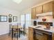 Charming kitchen with breakfast table and wood cabinetry at 540 Hunter Cir, Kissimmee, FL 34758