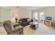 Cozy living room featuring comfortable seating and a coffee table at 563 Water St # 563, Celebration, FL 34747