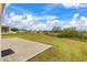 Large backyard with patio, grassy area, and view of neighborhood at 5793 Dornich Dr, Auburndale, FL 33823