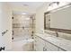 Updated bathroom with granite countertops and a walk-in shower at 580 Teesdale, Haines City, FL 33844