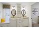 Elegant bathroom with granite vanity, double sinks and window at 580 Teesdale, Haines City, FL 33844